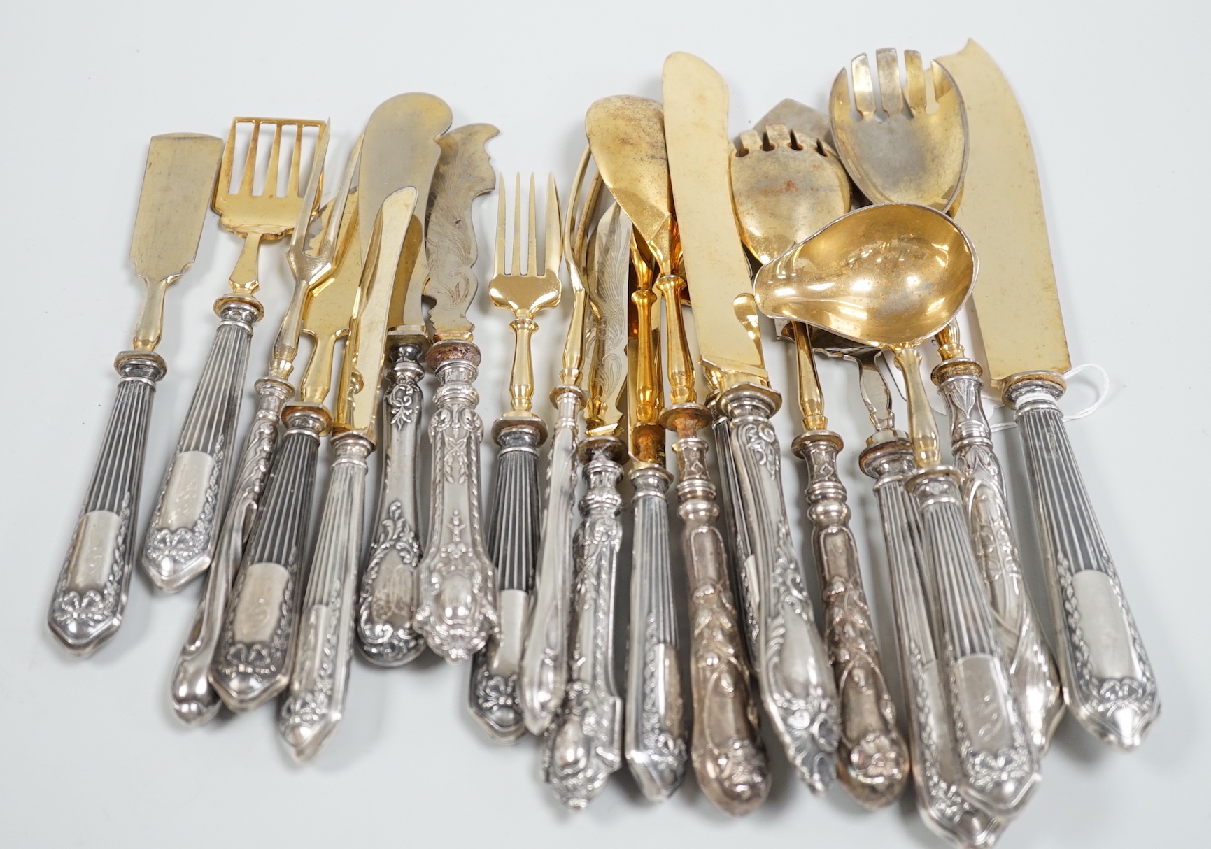 Nineteen assorted items of early 20th century Russian 84 zolotnik cutlery, including servers, butter knives, ladle etc, (loaded handles).